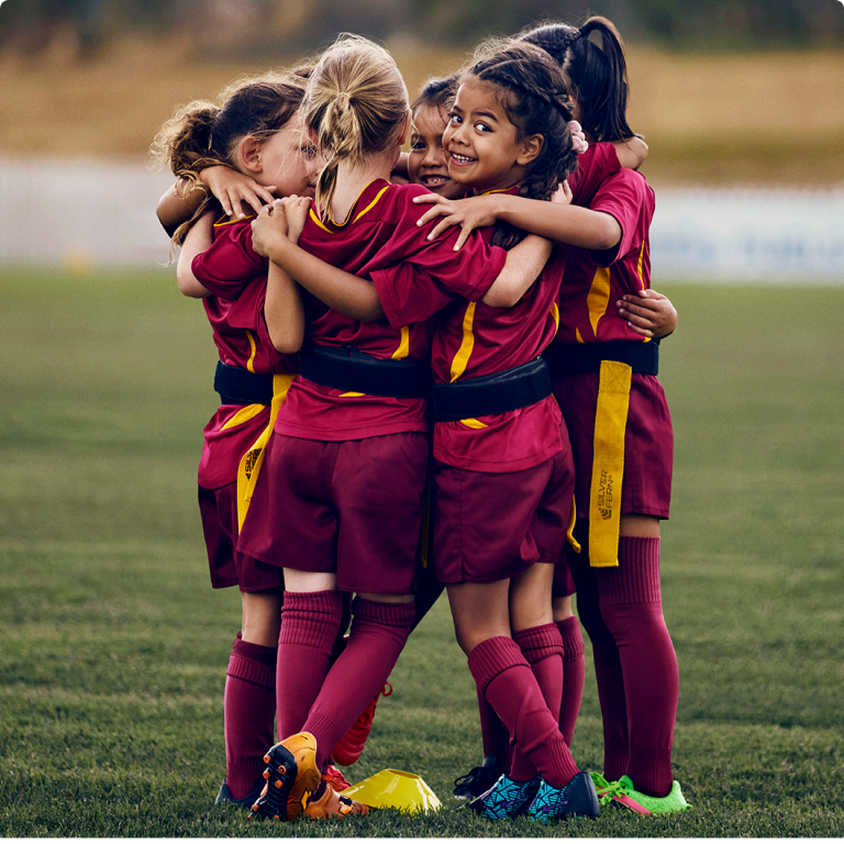 Young girl ripper rugby sport team in a huddle