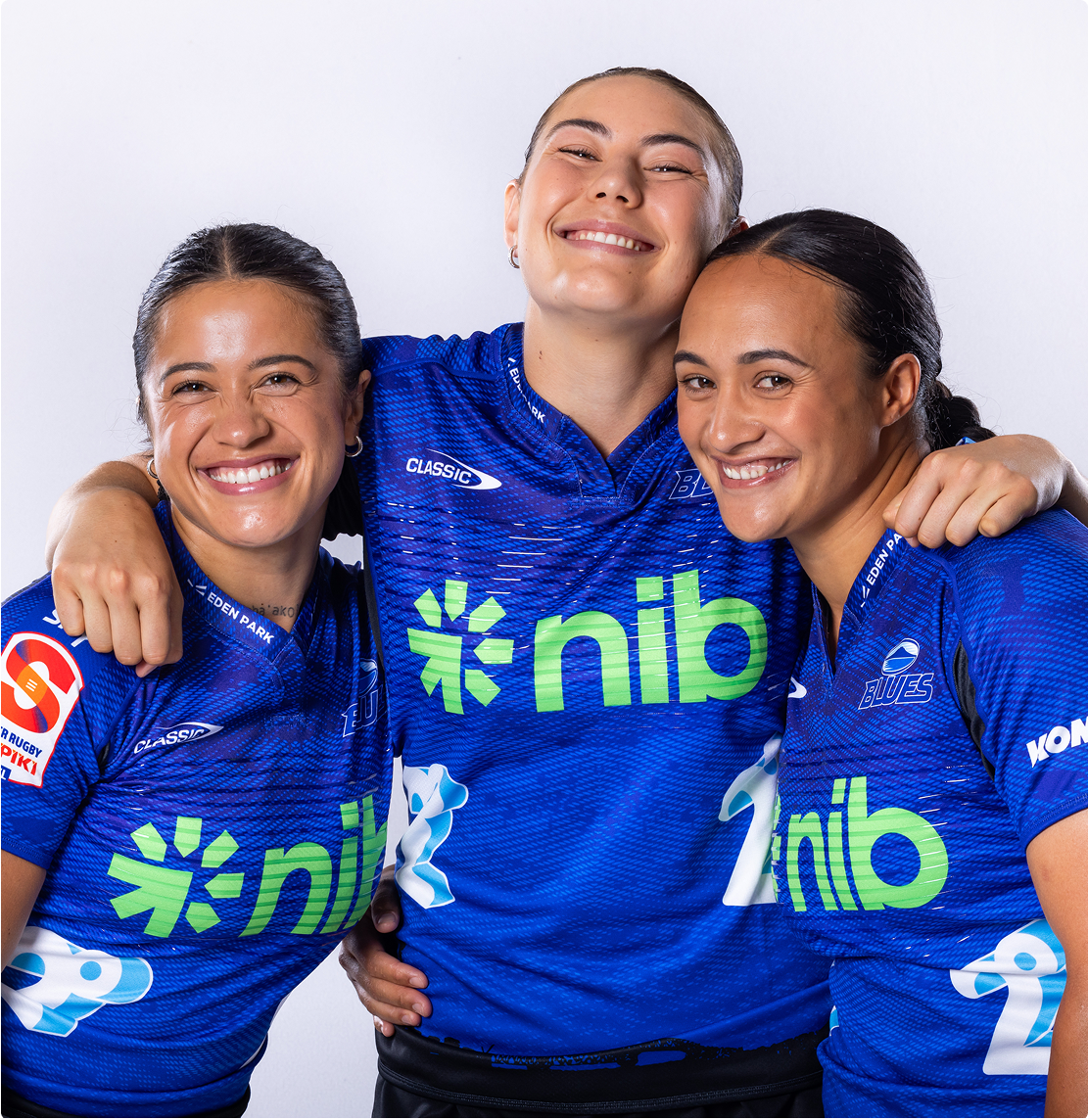 Photo of Katelyn Vahaakolo and two other members of the Woman's Blues Rugby team