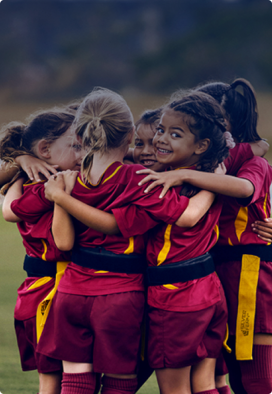 Young girl ripper rugby sport team in a huddle