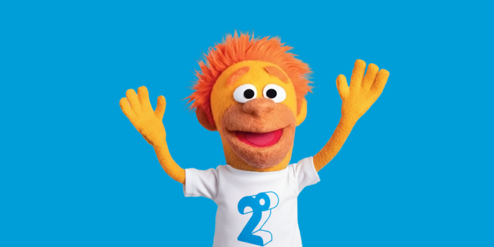 Image of the Slingshot puppet mascot changing branding to 2degrees by wearing a white t-shirt with a 2degrees logo